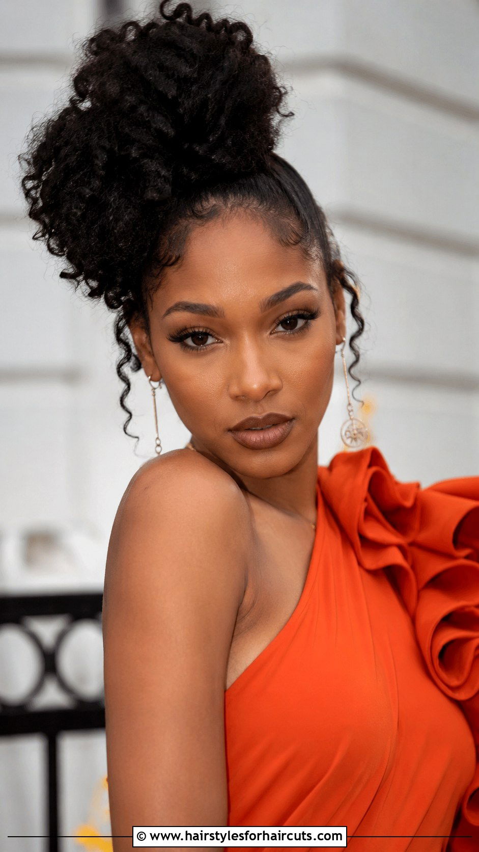 Asymmetrical Curly Bun - 25 curly bun hairstyles for black hair - 25 curly bun hairstyles for black hair