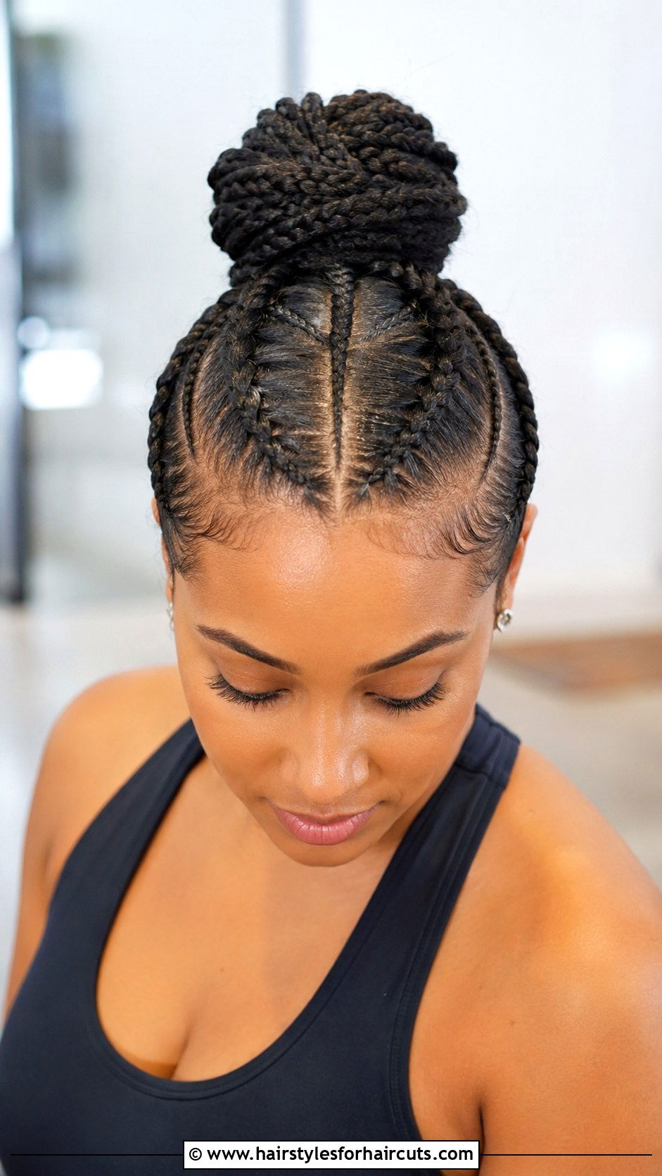 Braided Top Knot - 25 gym hairstyles for curly hair - 25 gym hairstyles for curly hair