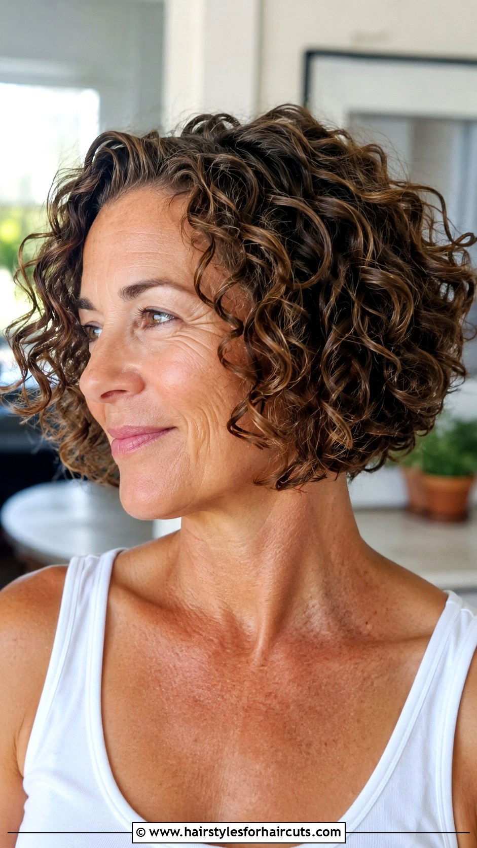 Chin Length Curly Bob - 25 haircuts for curly hair women over 50 - 25 haircuts for curly hair women over 50