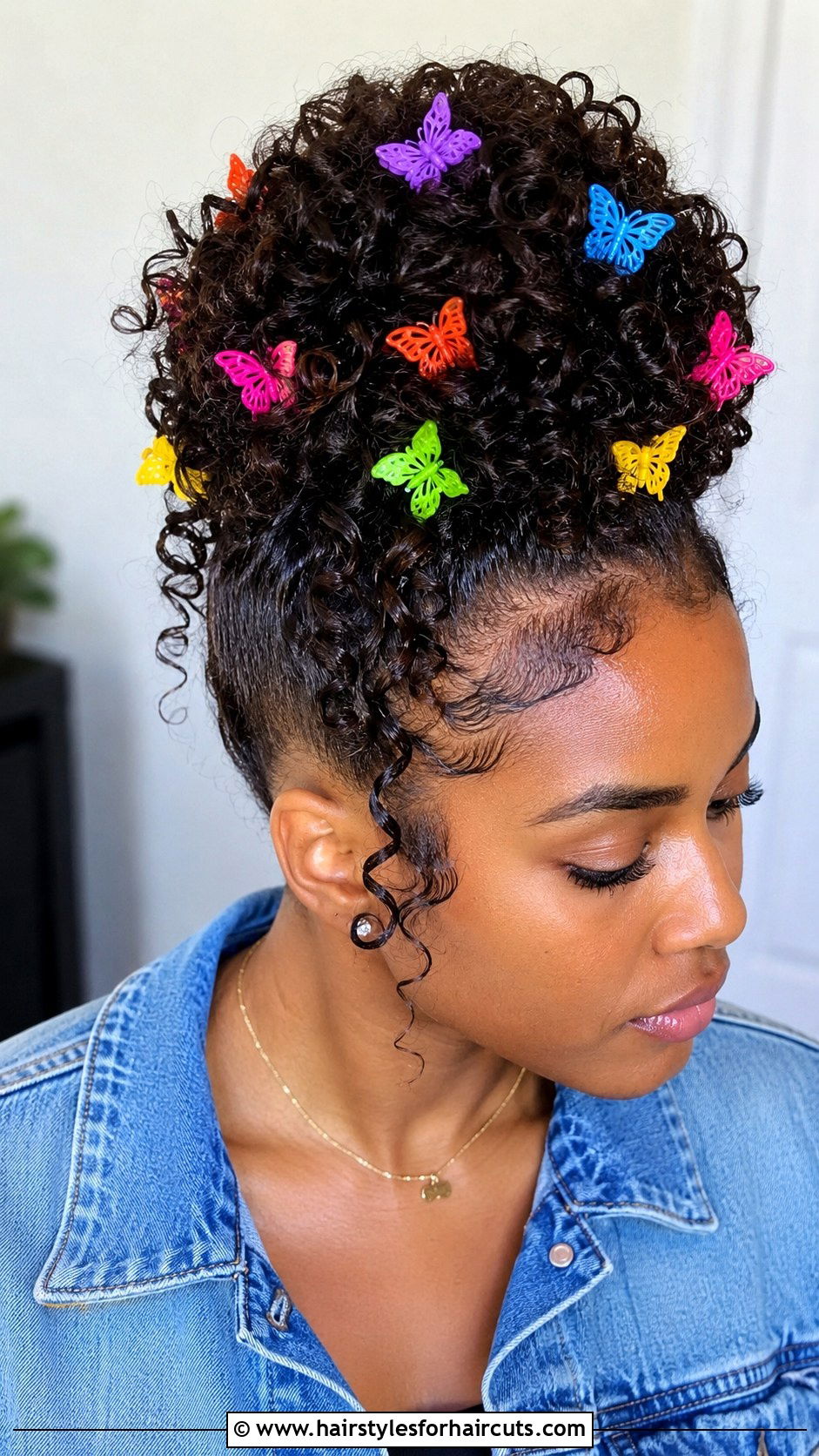 Curly Bun With Butterfly Clips - 25 curly bun hairstyles for black hair - 25 curly bun hairstyles for black hair