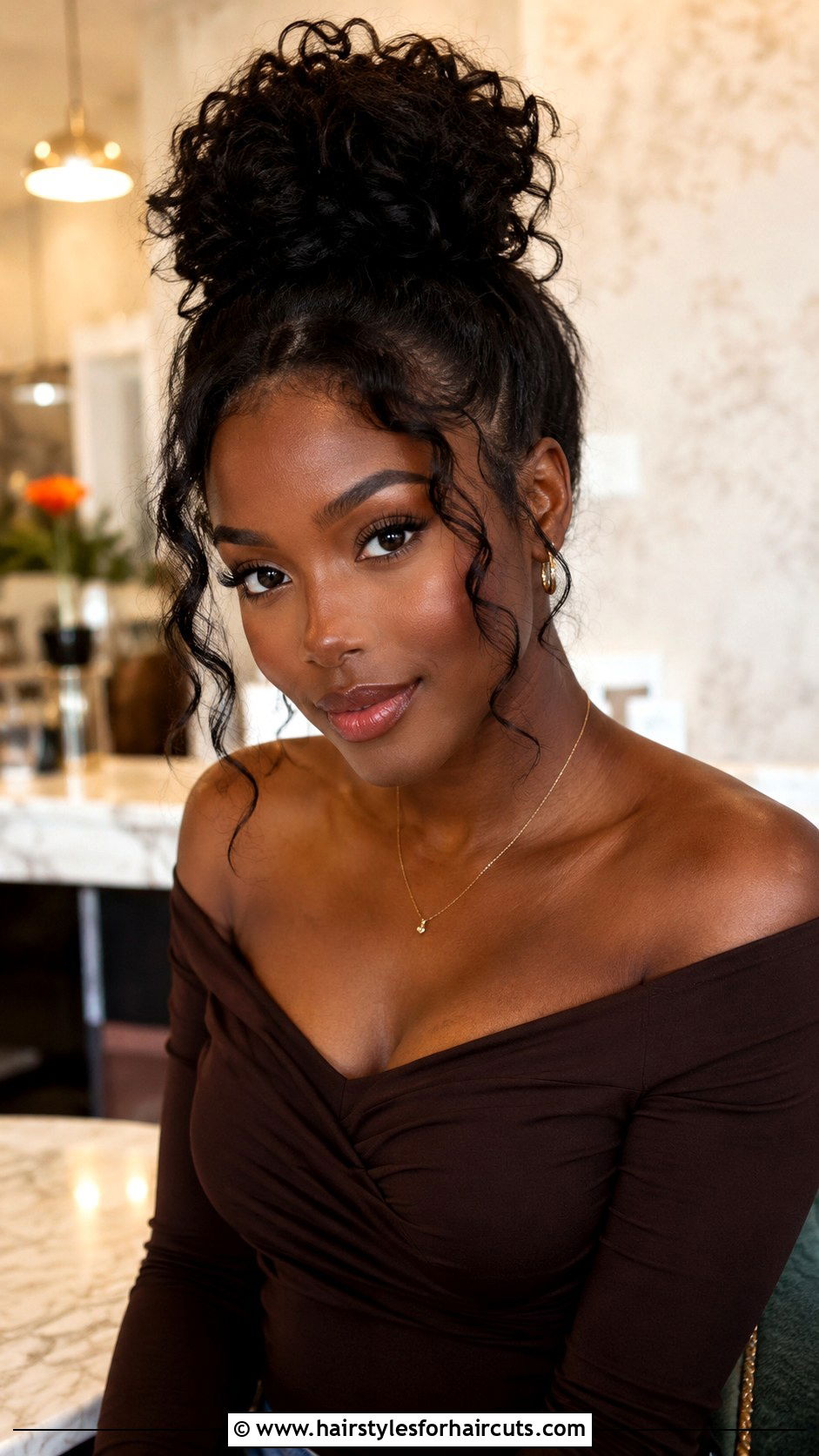 Curly Bun With Face Framing Tendrils - 25 curly bun hairstyles for black hair - 25 curly bun hairstyles for black hair