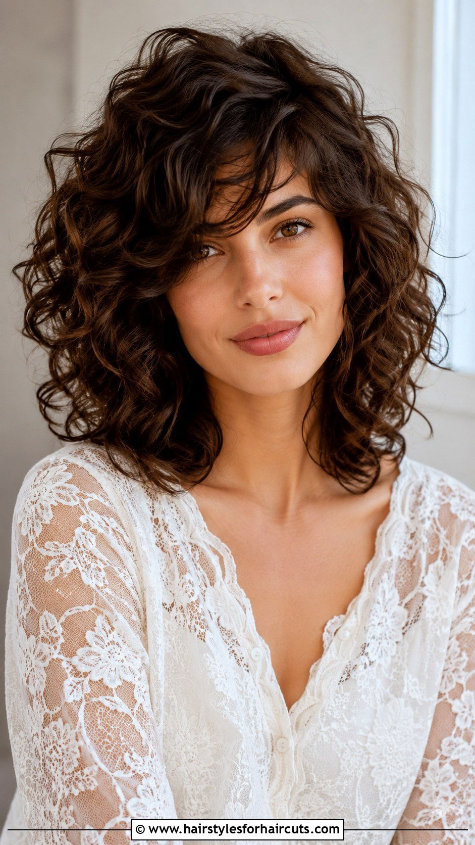 Curly Layered Hair With Side Swept Bangs - 25 bang haircuts for curly hair - 25 bang haircuts for curly hair
