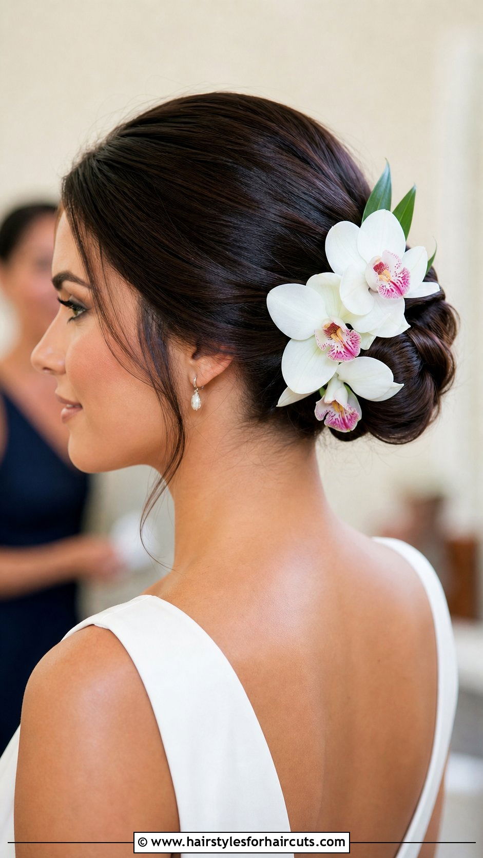 Flower Adorned Low Bun - 25 hairstyles for beach wedding - 25 hairstyles for beach wedding