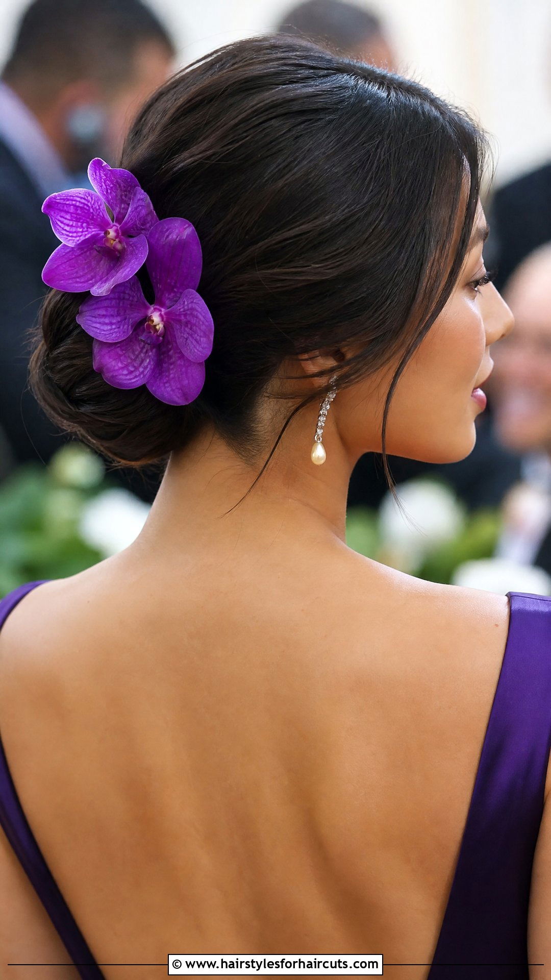 Low Chignon With Orchids - 25 flower in hairstyles - 25 flower in hairstyles
