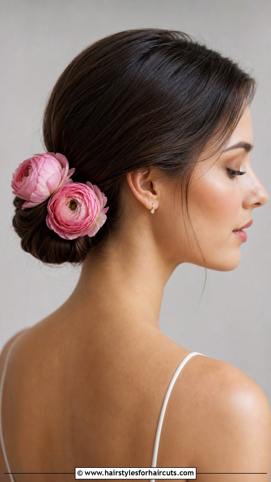 Low Chignon With Ranunculus - 25 wedding hairstyles with flowers for long hair - 25 wedding hairstyles with flowers for long hair