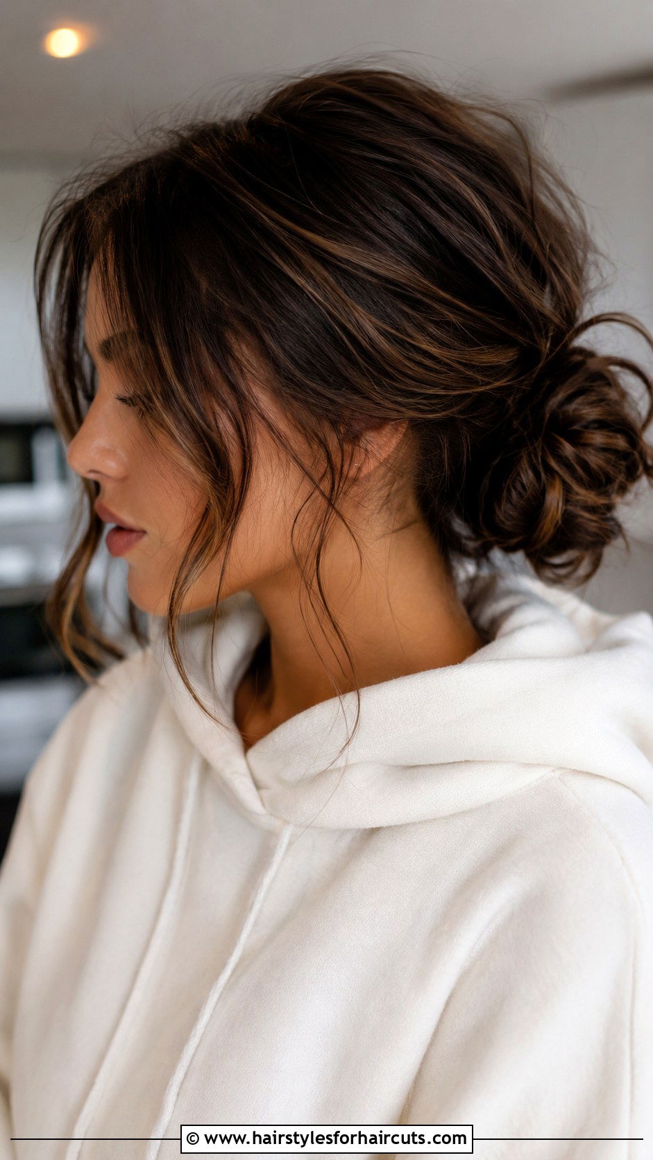 Low Messy Bun - 25 easy black hairstyles - 25 easy black hairstyles