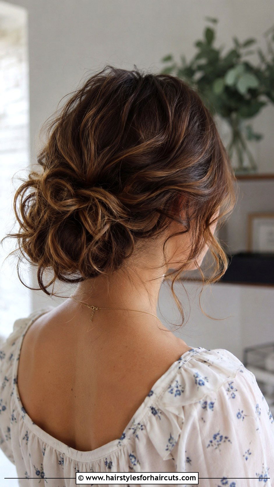Low Messy Curly Bun - 25 graduation hairstyles for curly hair - 25 graduation hairstyles for curly hair