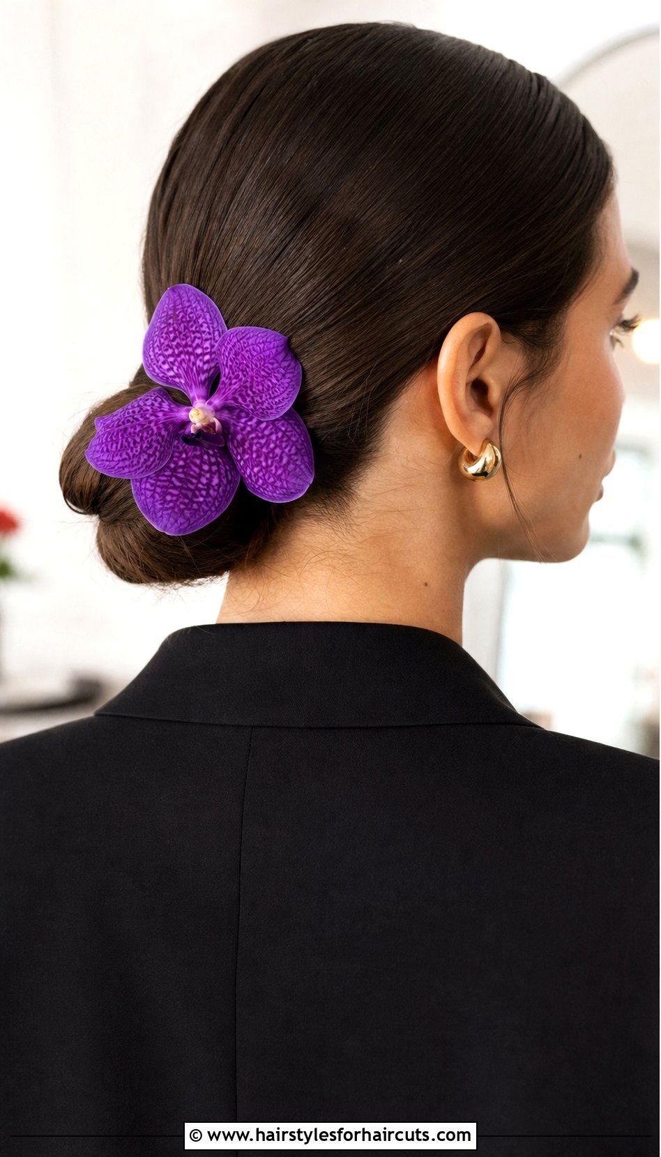 Sleek Low Bun With Orchids - 25 hairstyles with flowers - 25 hairstyles with flowers