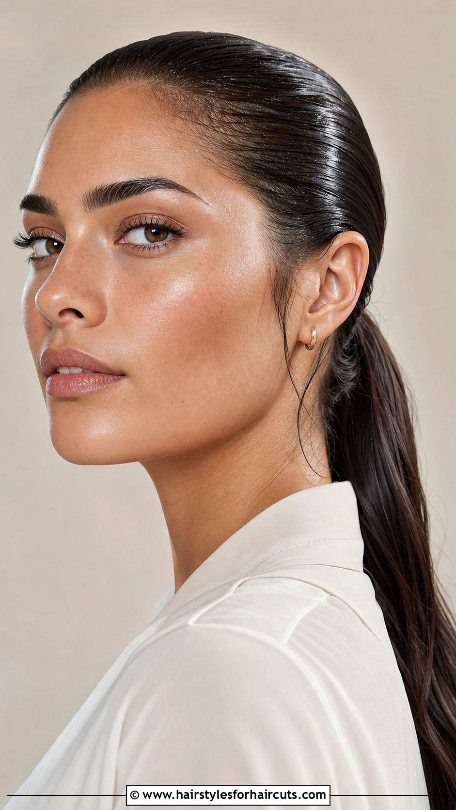 Slicked Back Wet Look Ponytail - 25 wet look hairstyles for black hair - 25 wet look hairstyles for black hair