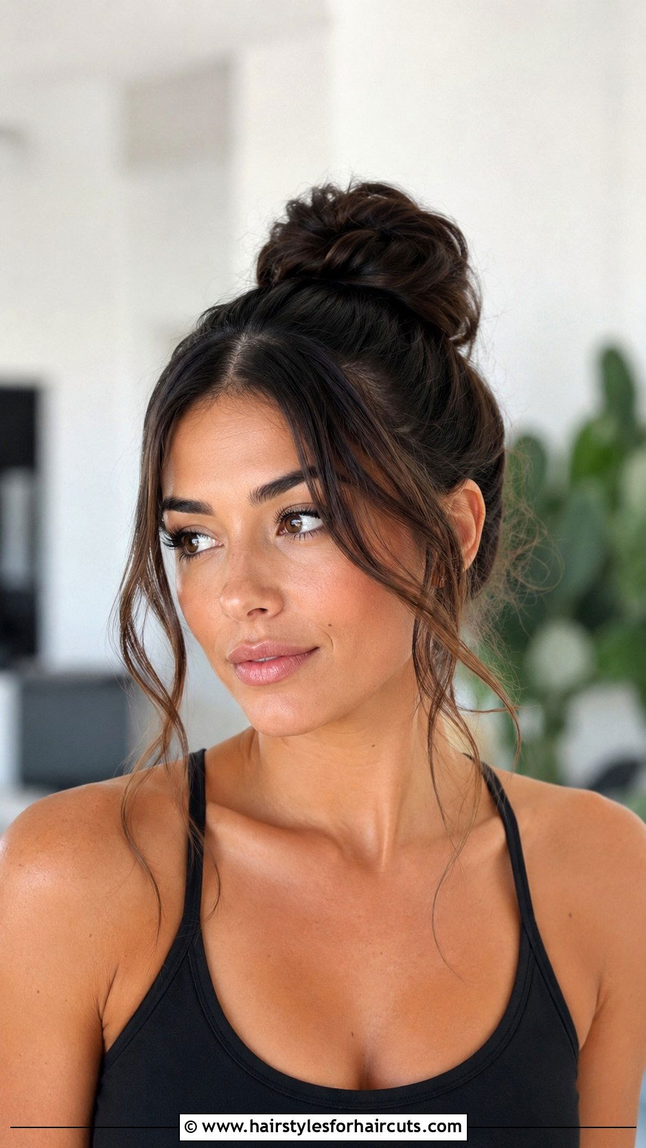 Top Knot With Face Framing Tendrils - 25 easy hairstyles for layered hair - 25 easy hairstyles for layered hair