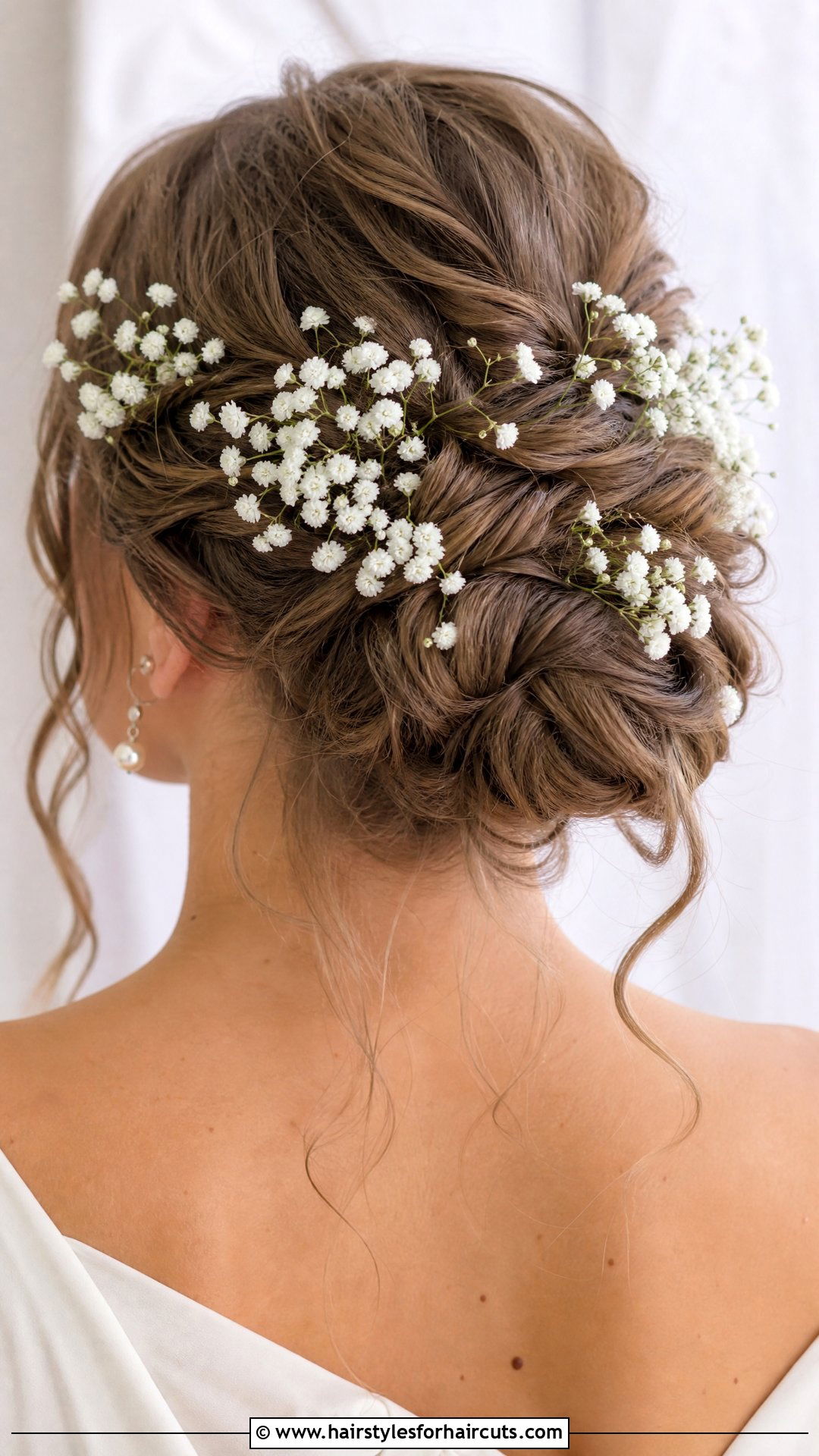 Twisted Updo With Baby Breath Flowers - 25 wedding hairstyles for saree - 25 wedding hairstyles for saree
