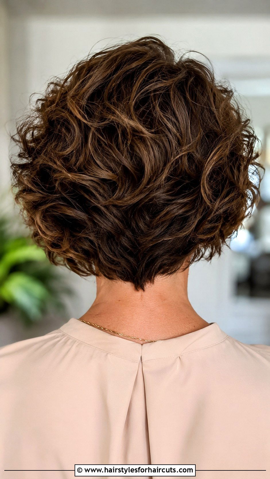 V Cut Curly Bob - 25 bob hairstyles for curly hair over 50 - 25 bob hairstyles for curly hair over 50