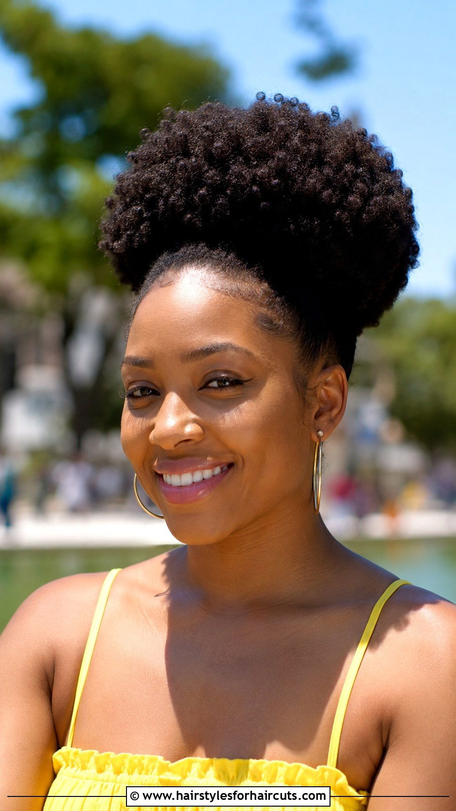 Voluminous Curly Afro Puff - 25 graduation hairstyles for curly hair - 25 graduation hairstyles for curly hair